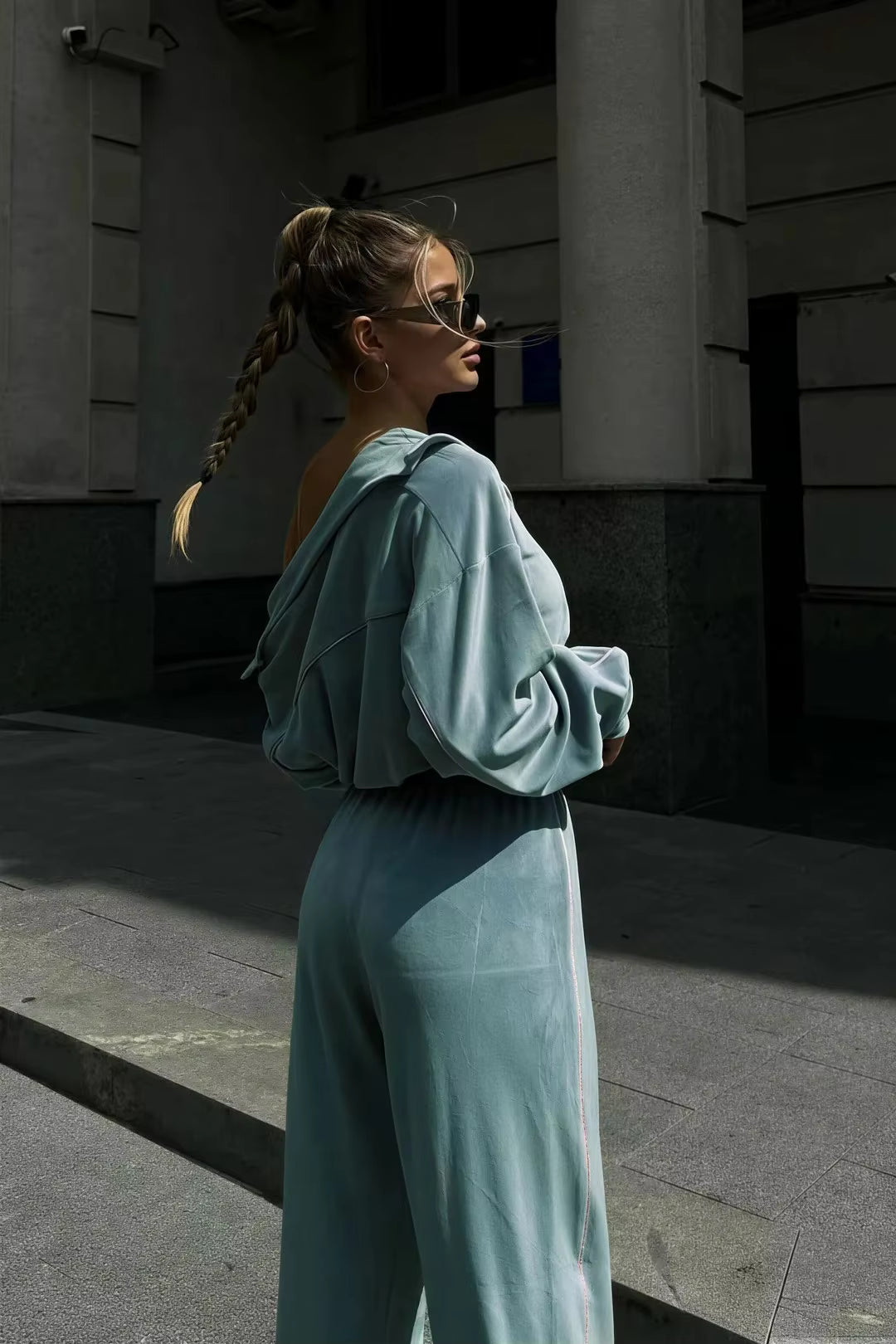 Sky blue track jacket and wide-leg pants set side-back view with white contrast piping