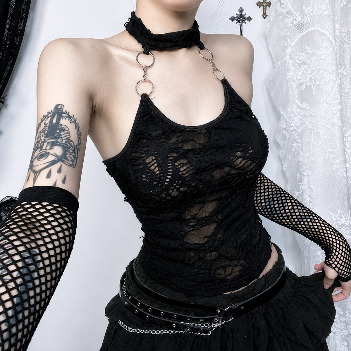 Black gothic punk lace halter top with silver ring straps, styled with fishnet sleeves and a studded belt