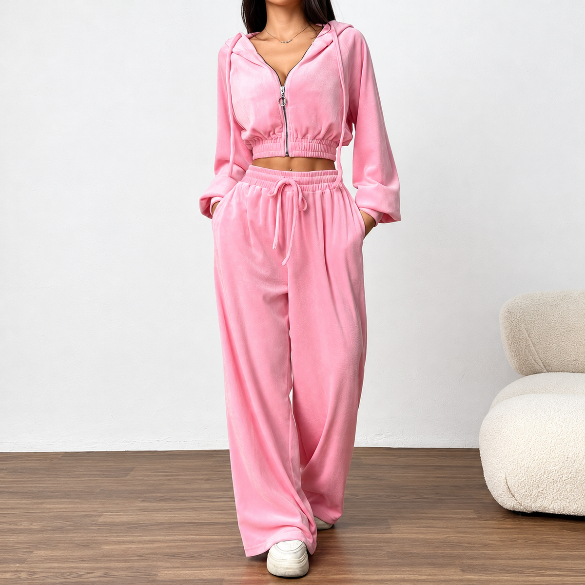 Pink velour two-piece tracksuit with cropped zip hoodie, side pockets and flowing wide-leg pants