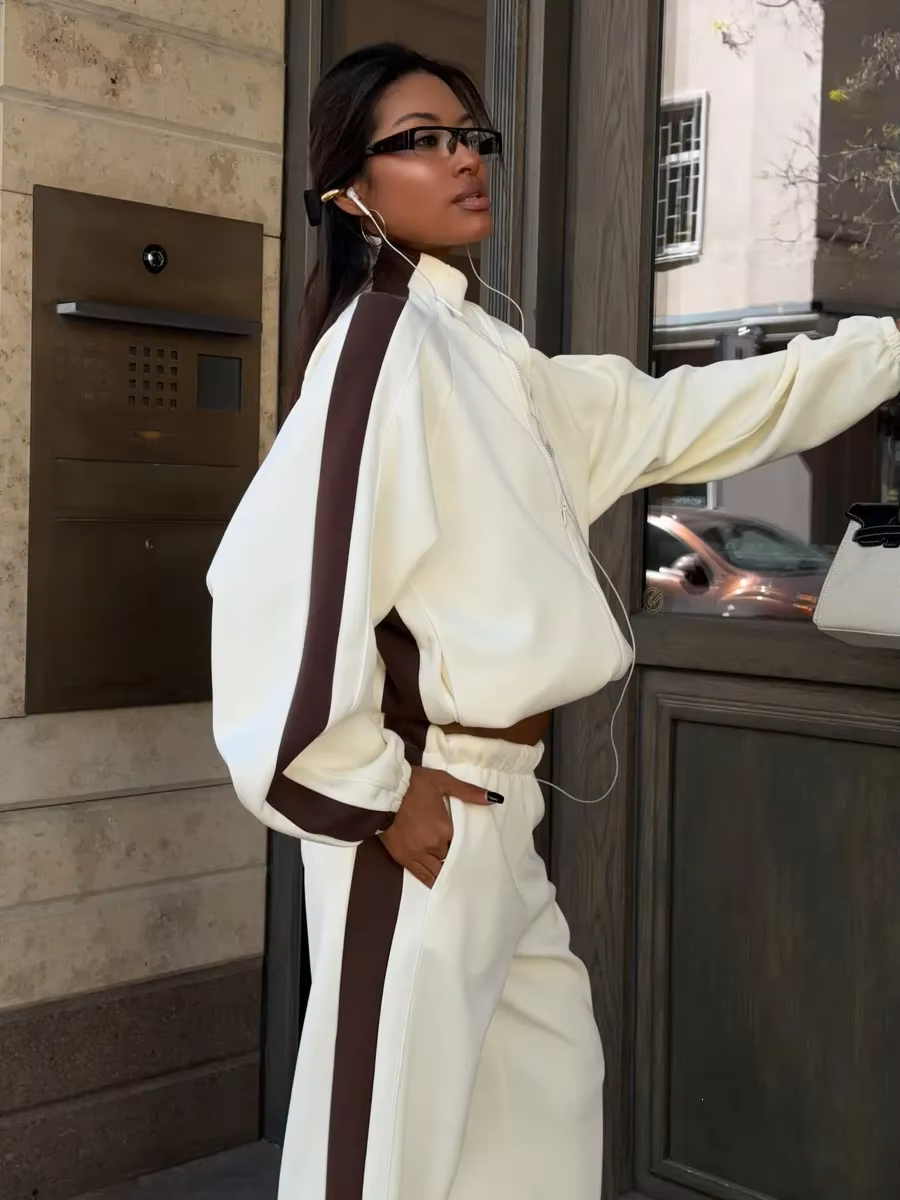 Ivory track jacket and wide-leg pants set with chocolate brown contrast sleeve and side stripes