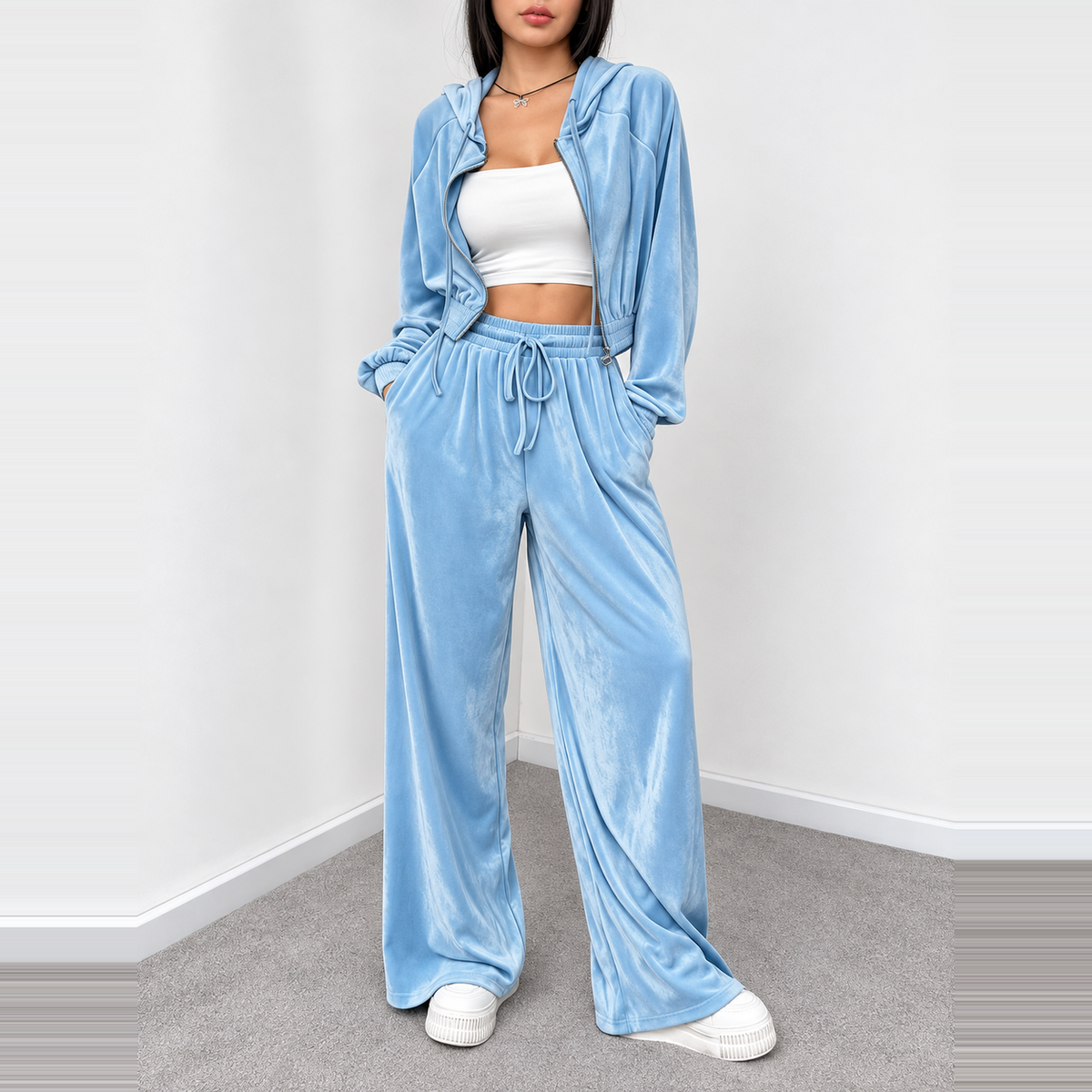 Light blue velour cropped hoodie and wide-leg pants set styled with a white crop top and platform sneakers