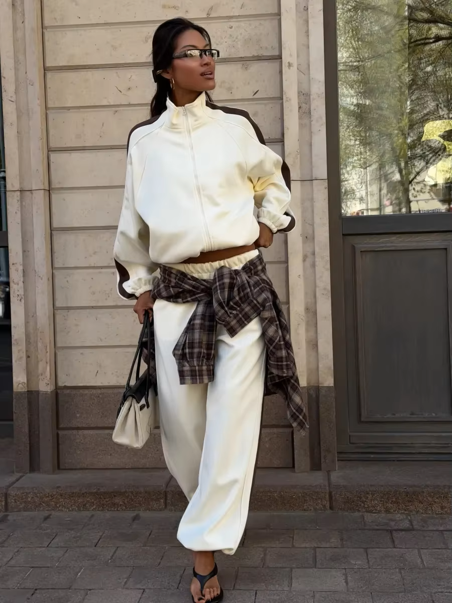 Ivory track jacket and wide-leg pants set with chocolate brown contrast sleeve and side stripes
