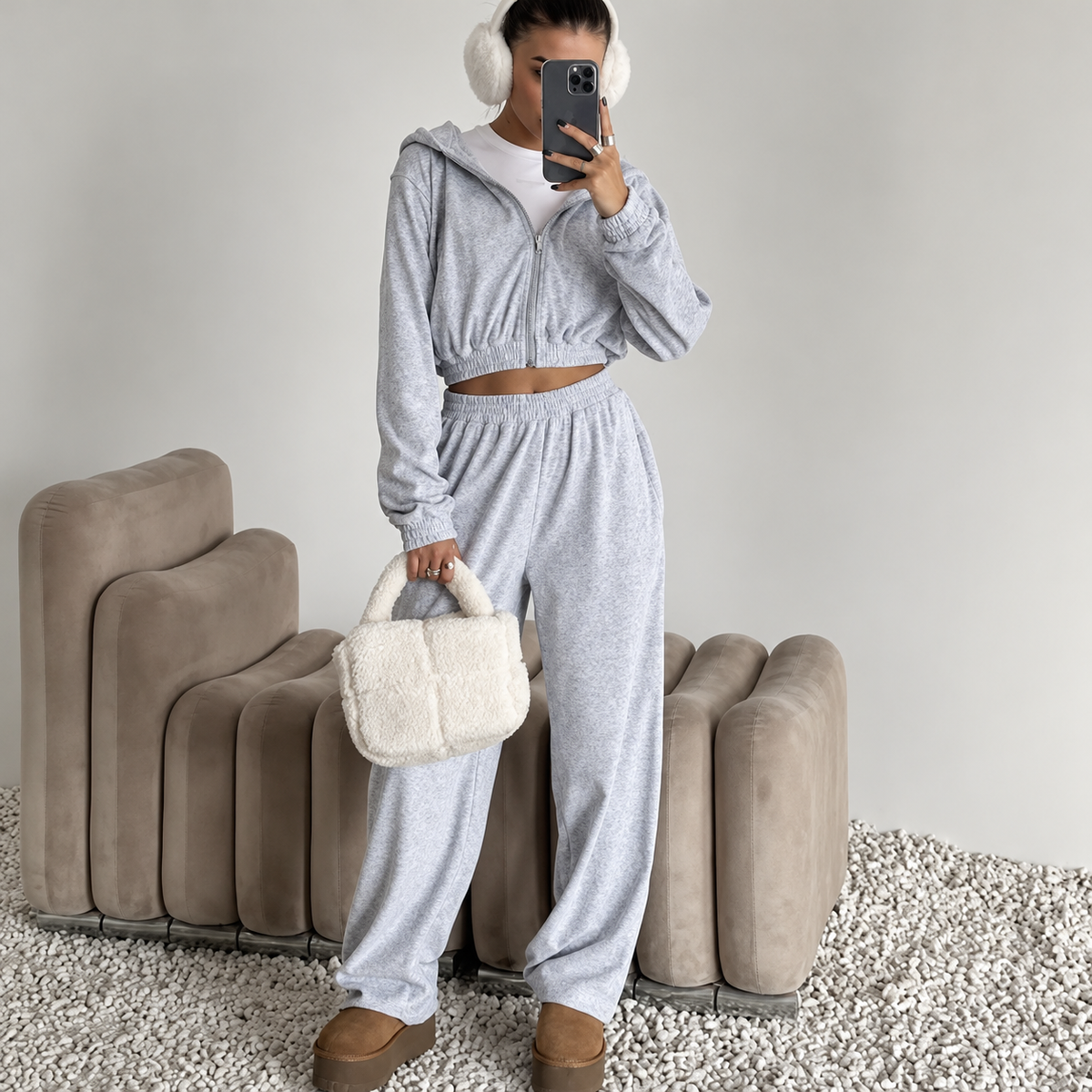 Grey cropped hoodie and baggy pants tracksuit set styled as a relaxed streetwear outfit