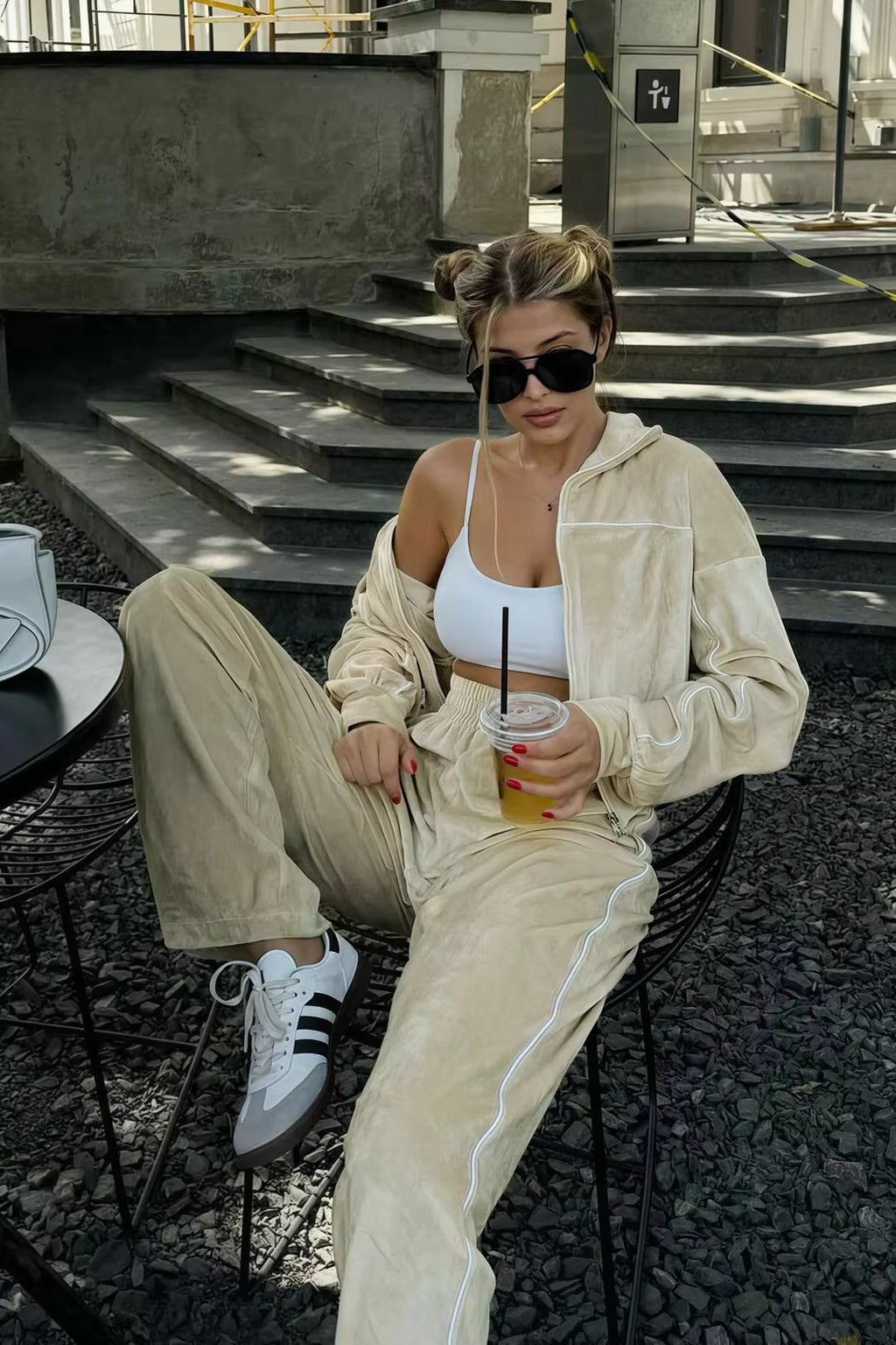 Ivory two-piece track set with cropped jacket, wide-leg pants and sporty contrast piping