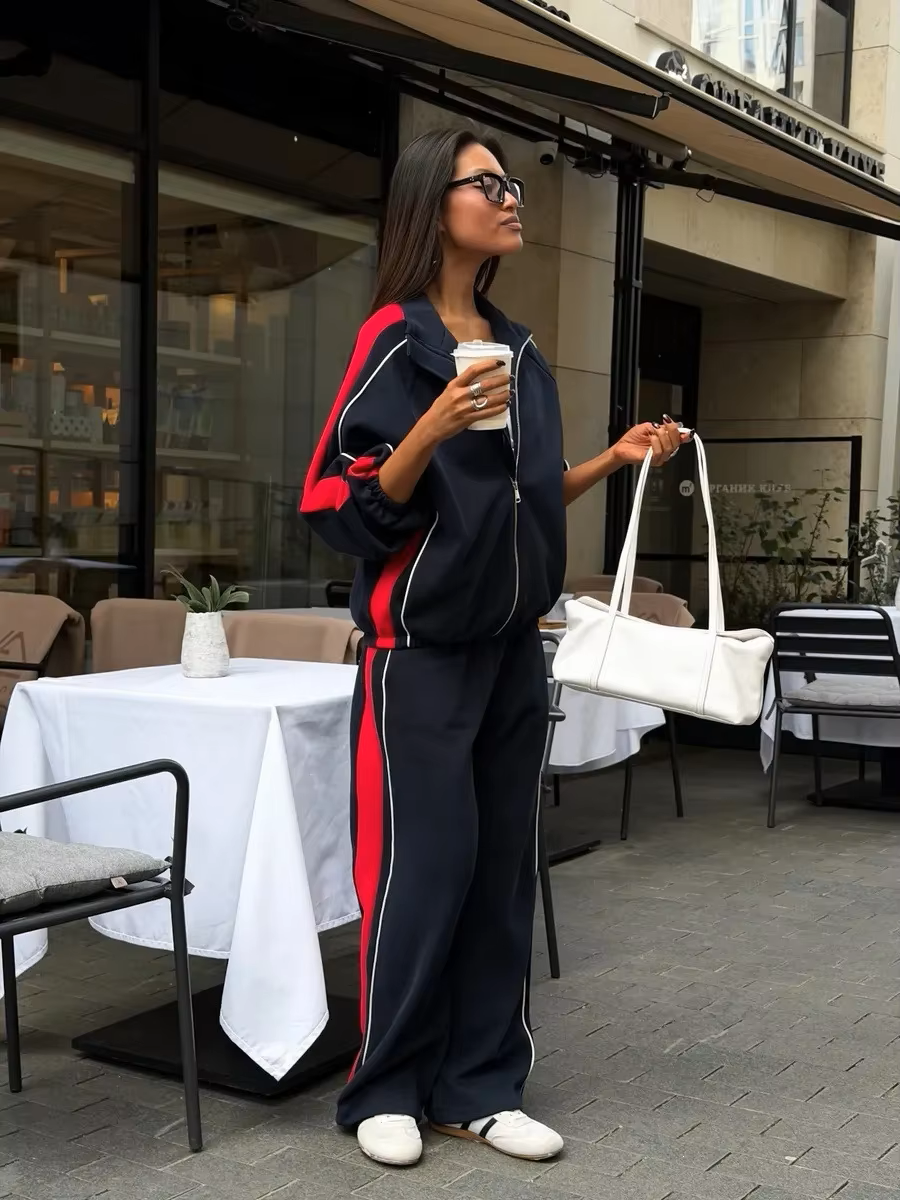 Navy blue tracksuit with red side panels, contrast piping and wide-leg track pants