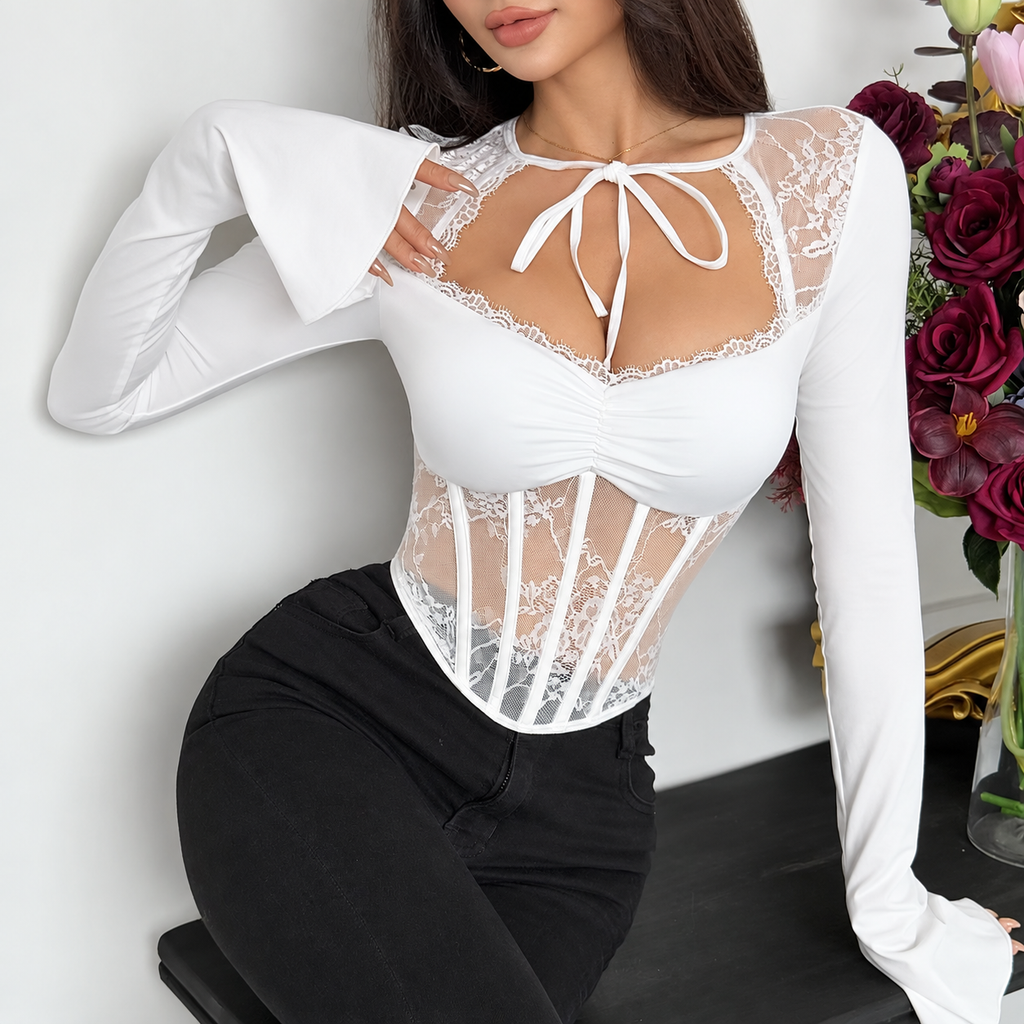 Angled view of tie-front corset top showing lace neckline, ruched bust and flared bell cuffs