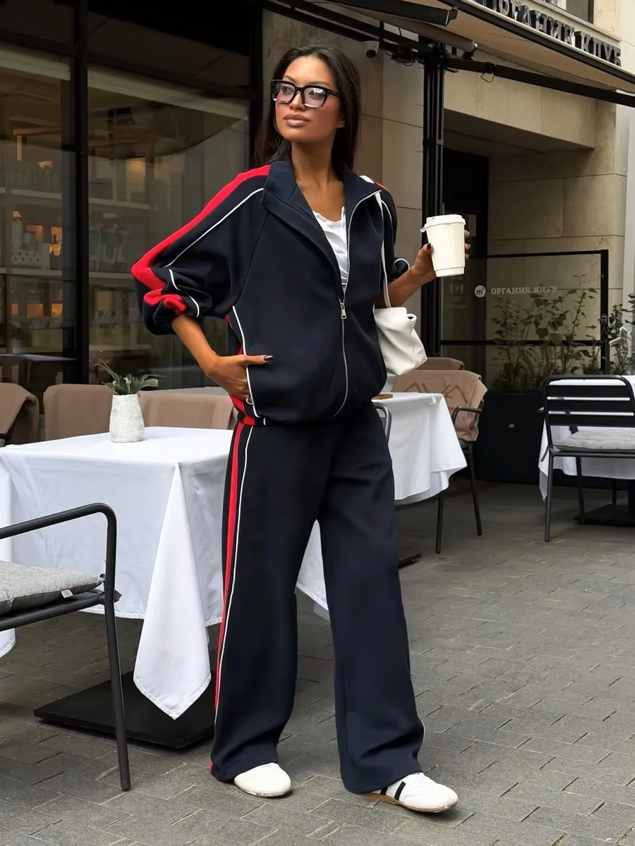 Navy blue tracksuit with red side panels, contrast piping and wide-leg track pants