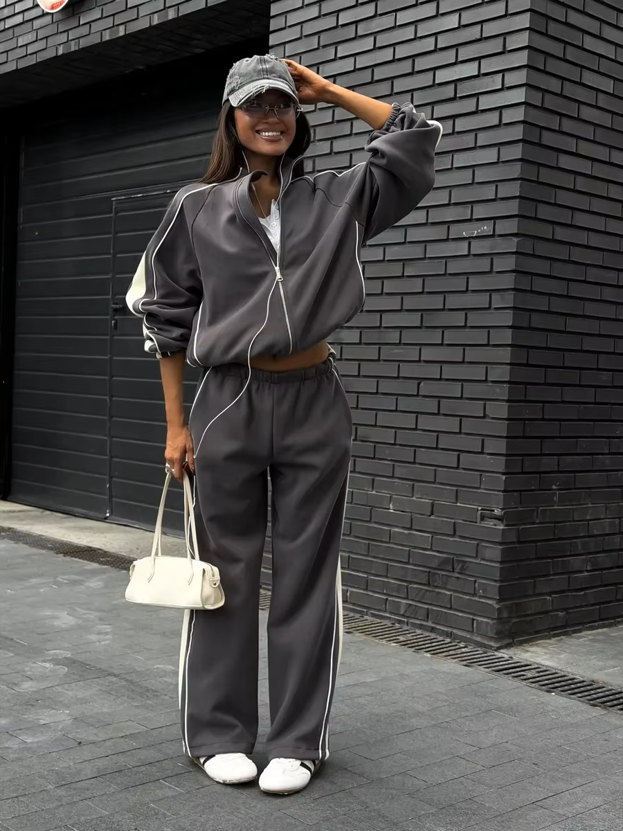 Charcoal gray contrast stripe tracksuit with cream side panels, zip jacket and wide-leg pants