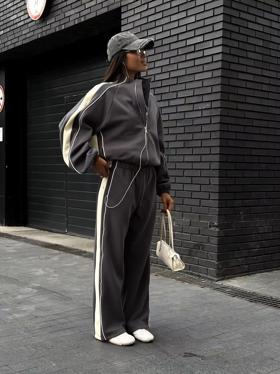 Charcoal gray contrast stripe tracksuit with cream side panels, zip jacket and wide-leg pants