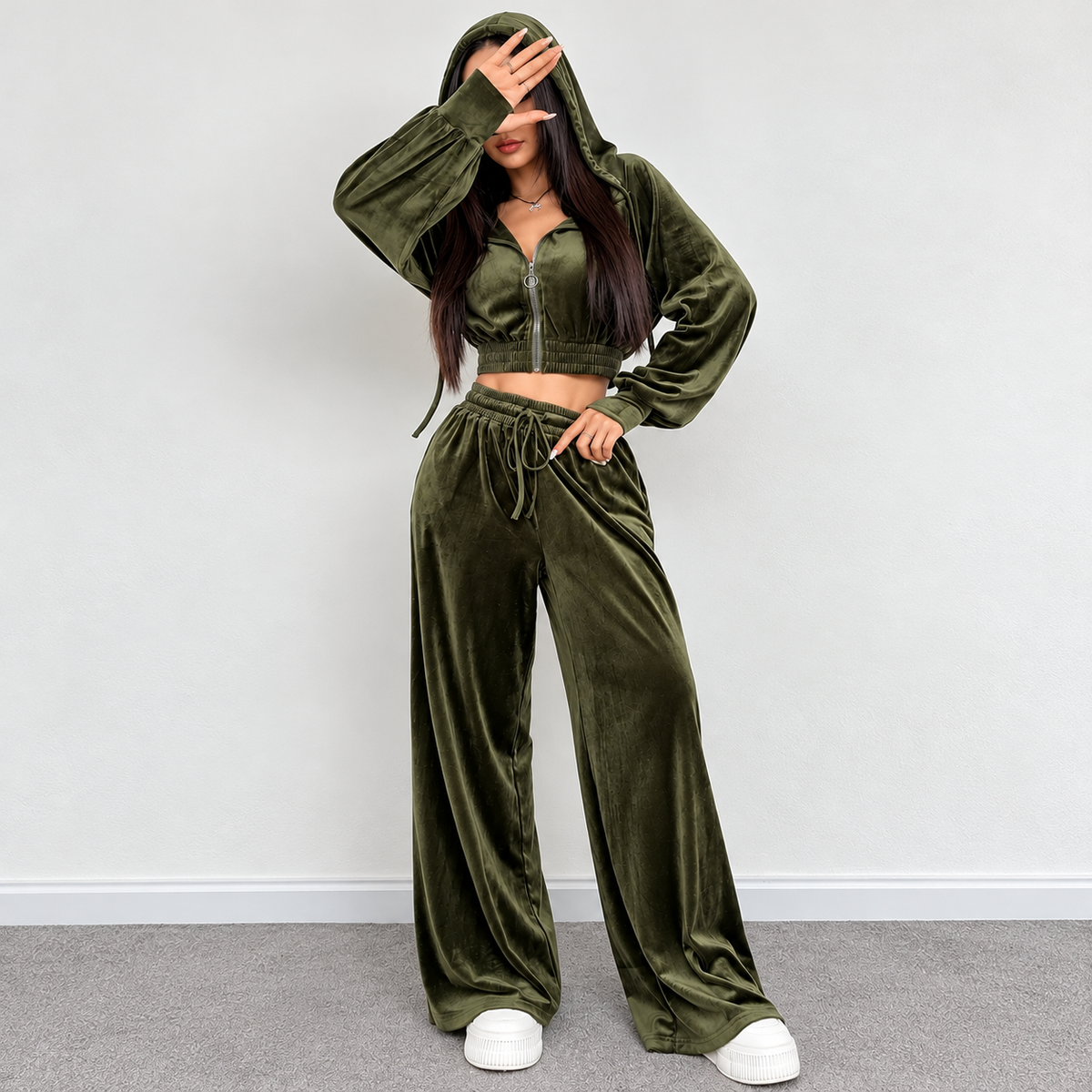 Olive green velour tracksuit with cropped hooded jacket, drawstring pants and relaxed wide-leg silhouette