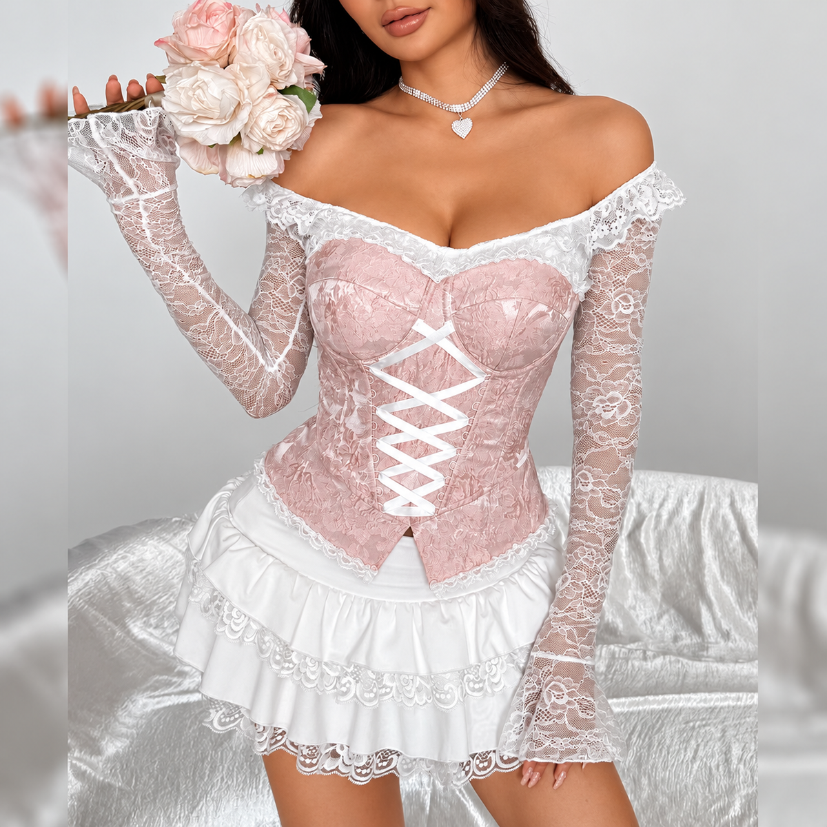 Jacquard corset top with ribbon front lacing styled with lace sleeves and a layered ruffle mini skirt