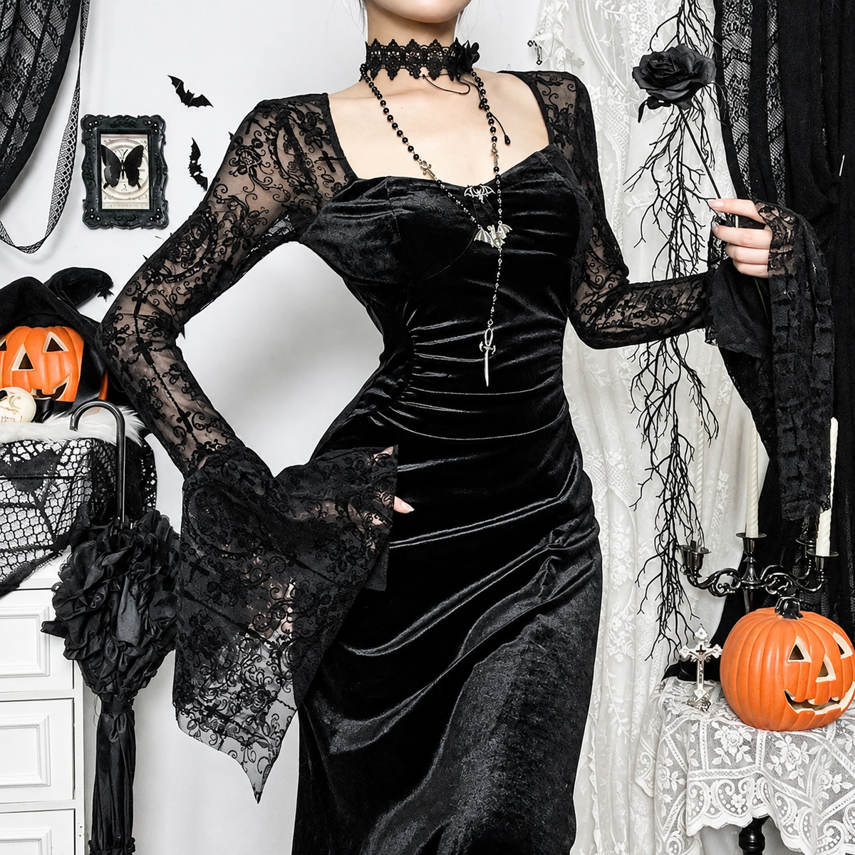 Black velvet gothic maxi dress with sheer floral lace bell sleeves, shown on a model – alternate view 2