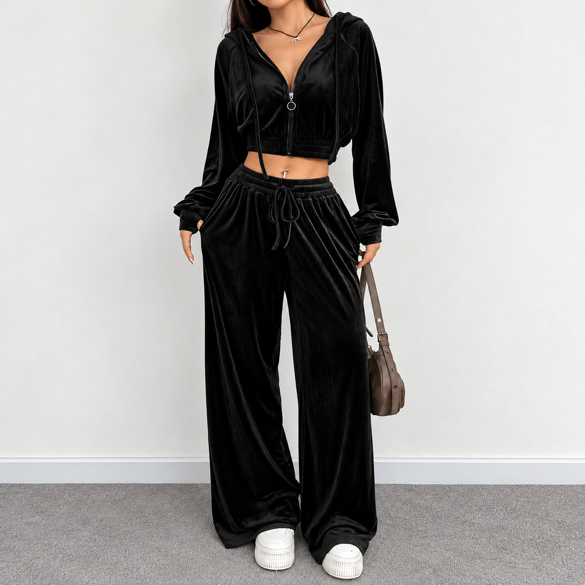 Black velour cropped hoodie and wide-leg pants matching set with zip front and drawstring waist