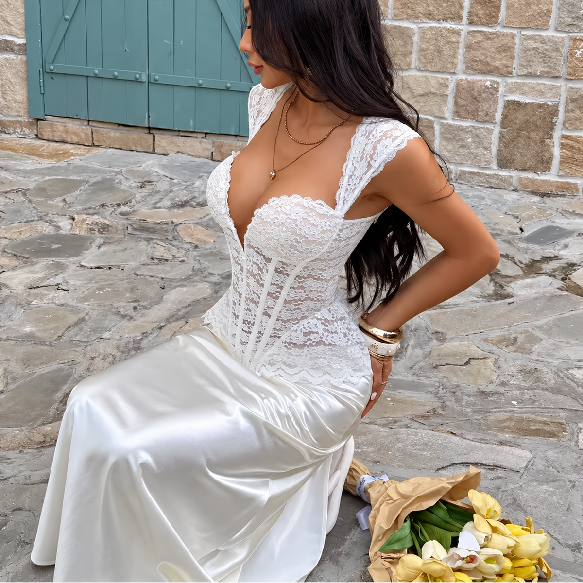 White lace corset bustier with sculpted cups, sheer floral lace and scalloped hem, three-quarter view