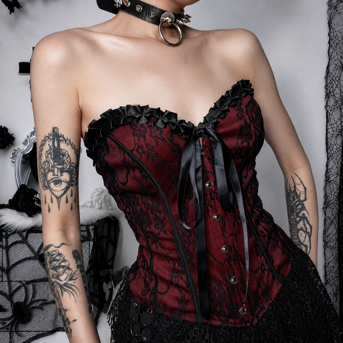 Red strapless corset top with black lace overlay and ribbon detailing