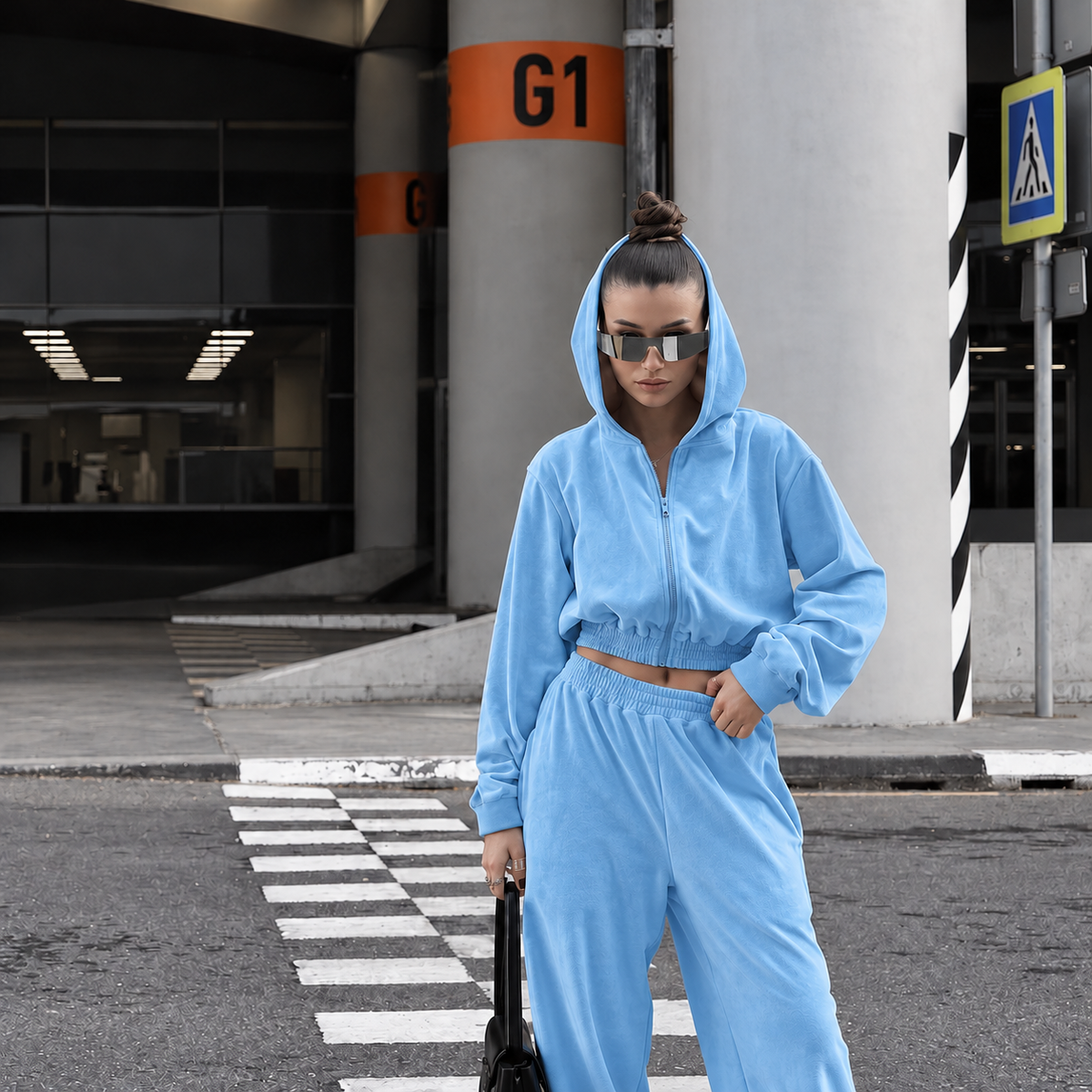 Light blue two-piece tracksuit with cropped zip hoodie, hood up and relaxed full-length pants