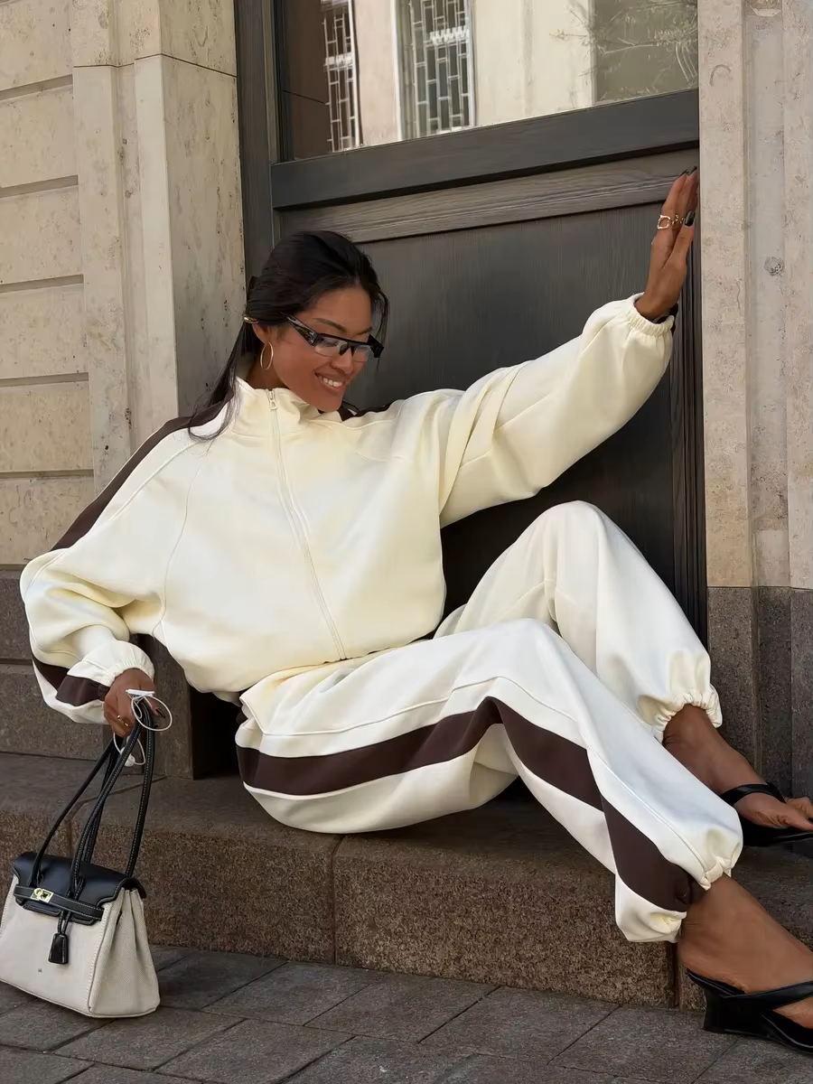 Ivory track jacket and wide-leg pants set with chocolate brown contrast sleeve and side stripes