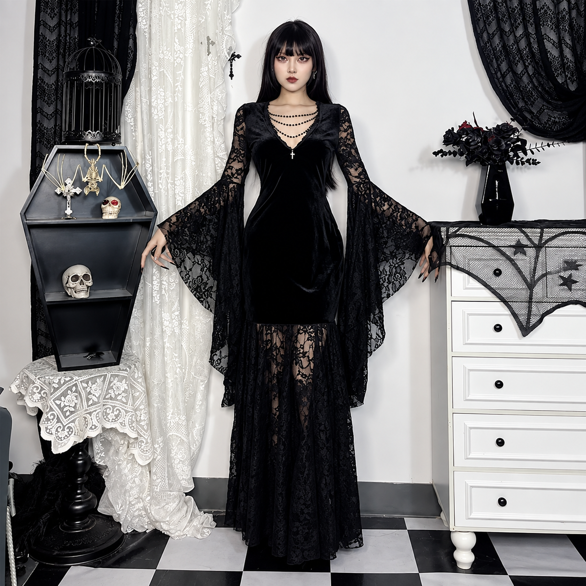 Black velvet lace maxi dress with dramatic bell sleeves and fitted silhouette